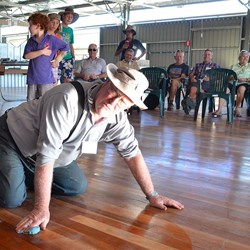 what's Scrubby doing? Cleaning the floor after the yabby races in the woolshed!