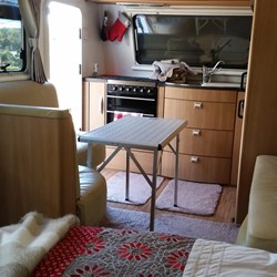 the dining area in the van with folding table