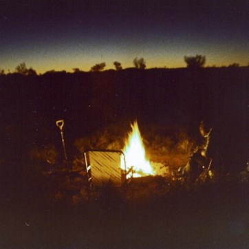 Writing the journal by the light of the campfire.