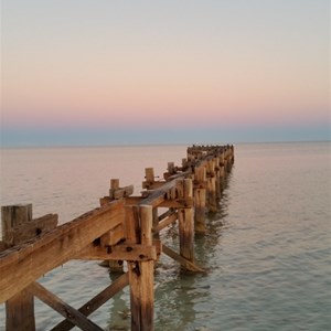 Sunrise with full moon over Gladstone Jetty