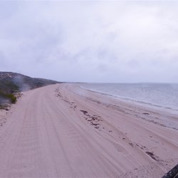 Part of the track runs along the beach