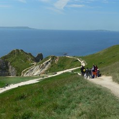 Durdle Door (rock arch) is just visible.