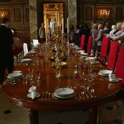 A throng of sightseers in the opulent rooms.