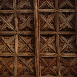 Intricately carved wooden ceiling.