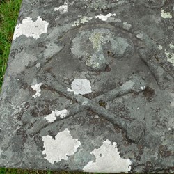 Skull and crossbone motif, seen on several of the stones.