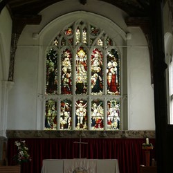 Stained glass reflecting the wealth of the local community.