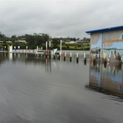 Flooded Mallacoota boat ramp and buildings