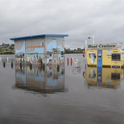 flooded Mallacoota boat ramp and buildings