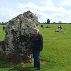Val beside one of the standing stones at Stanton Drew