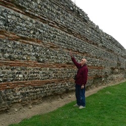 The best preserved part of the walls with one of the round towers visible