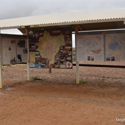 Small puddles of water on the side of the information shelter at Lake Eyre South