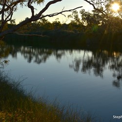 Sun setting over the Algebuckina Waterhole after another great day on the Oodnadatta Track