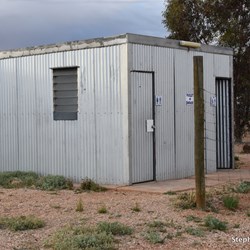 The shower block next morning and a very dark sky in the background