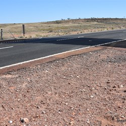 The Dog Fence crossing the Stuart Highway