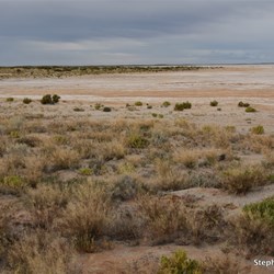 Dark clouds over our first sighting of Lake Eyre North