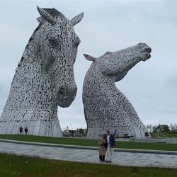 Rob and Val are dwarfed by the mighty Kelpies