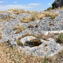 This small hole cut through the limestone enabled goods to be hoisted to the area above the cave