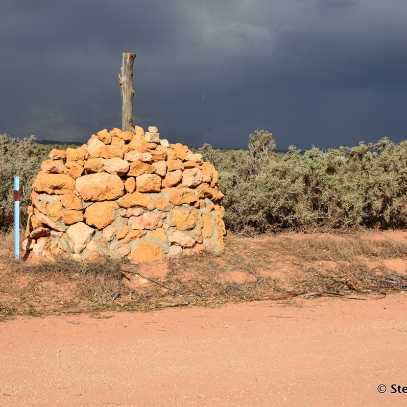 Border Survey Stone Cairn and those dark clouds