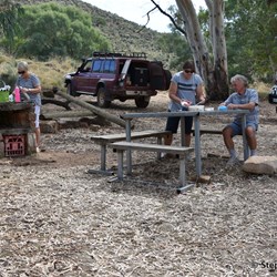 And the BBQ area is complete with this table and seats