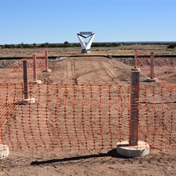 The bunting and bollards to stop visitors crossing the Railway Line