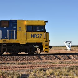 The Indian Pacific passing slowly, with the Memorial on the Northern Side of the Line 