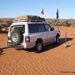 This Oil survey marker is showing how the sand has blown away over the years