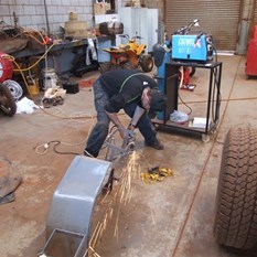 Scotty cutting the jerry can holders off - he just loves that grinder work!