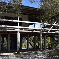 These old shacks right on the beach - what a waste, were once owned by Cooktown locals until.....