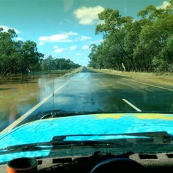 Water flowing across the road on the way to Cobar.