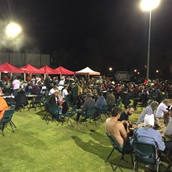 Dinner on the Roxby Downs oval.  Some were rugged up against the cold, others were mostly naked