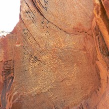 The strange man with the hat rock carving!