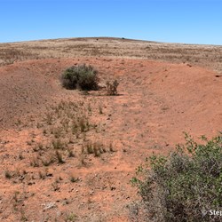 Standing on top of the blast wall looking into one of the munitions bunkers