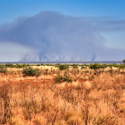 Traditional Aboriginal burn-off way off in the distance 