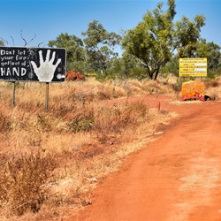 Roadside sign close the end on the Tanami