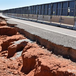 The damage to the Stuart Highway at Woocalla Creek.
