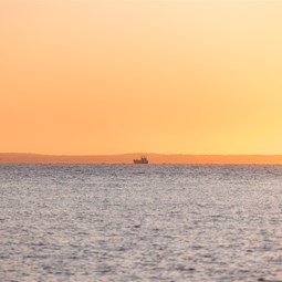 Barge in South Passage at sunrise