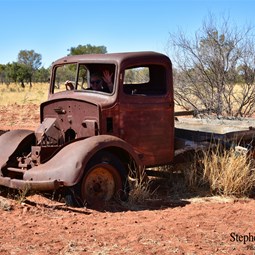 Old vehicle at the junction to MacDonald Downs Station