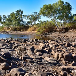 The end of the waterhole where you cross to get to the old ruins