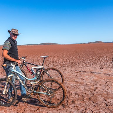 David holding the bikes near one of the smallest sculptures found on the outer ring