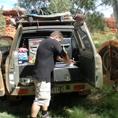 Masterfull bush chef at work (with flies!) 