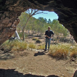 Hugh contemplating Lasseter's lonely demise (with a cigarette!)