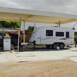 refuelling at Nullabor Roadhouse with plane at the pump behind us.