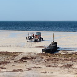 Tractor taking 'oyster boat' to deep water