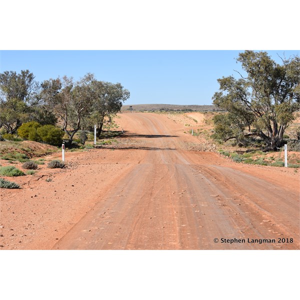 Slow right down on Oodnadatta Track water way crossing where there will be larger rocks