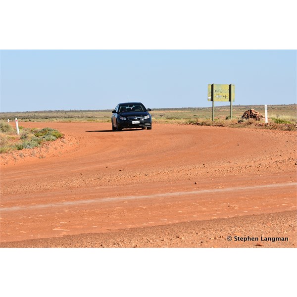 No vehicle lift, LT tyres or modest this stock small vehicle at the T junction, coming in from Coober Pedy