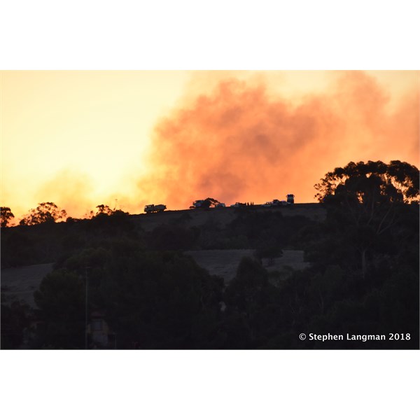 At dusk, the top of that hill was covered in CFS trucks to halt the advancing fire.