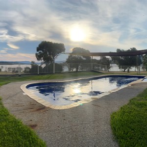 Outdoor seasonal swimming pool with lake views