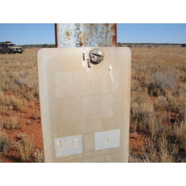 Post with location sign at a Benchmark on the Anne Beadell Highway