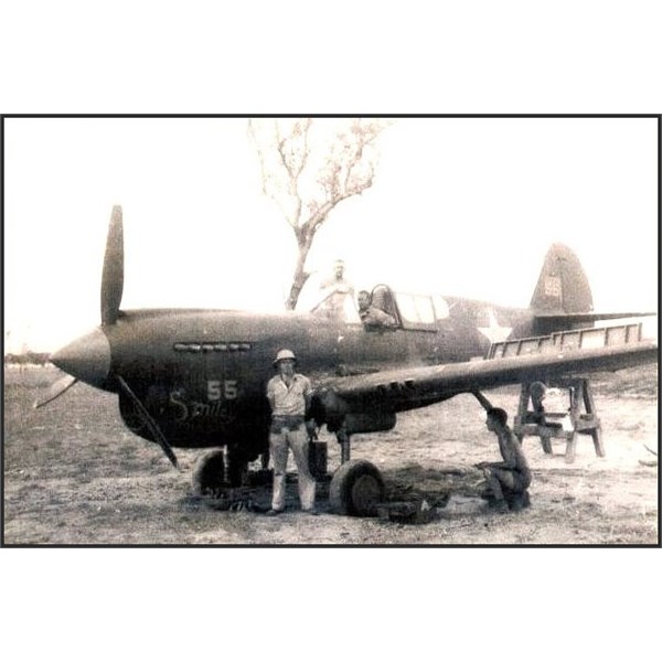 P-40 Kittyhawk Smiley , adjusting the .50 Cal machine guns