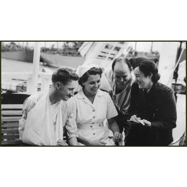 Lorraine Stumm, reporter for the Sydney Daily Telegraph interviewing on a hospital ship in Tokyo harbour in Sept' 1945